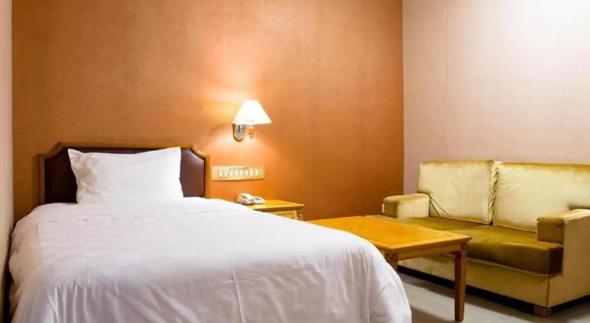 Bed in Nanfang Dasha Hotel