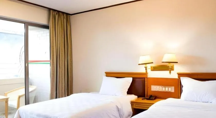 Bed in Nanfang Dasha Hotel