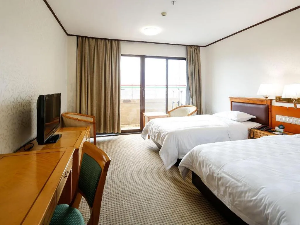 Bed in Nanfang Dasha Hotel