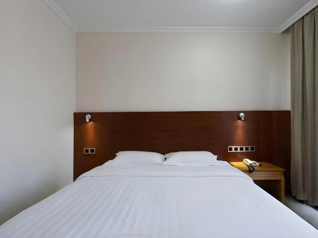 Bed in Nanfang Dasha Hotel