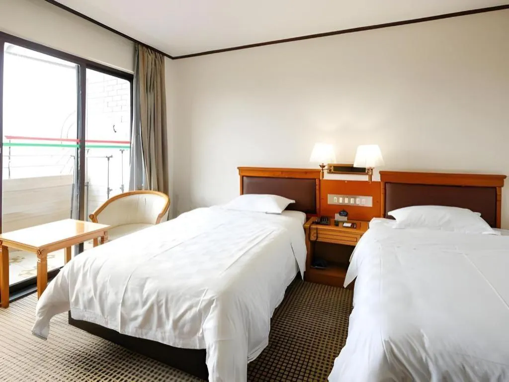 Bed in Nanfang Dasha Hotel