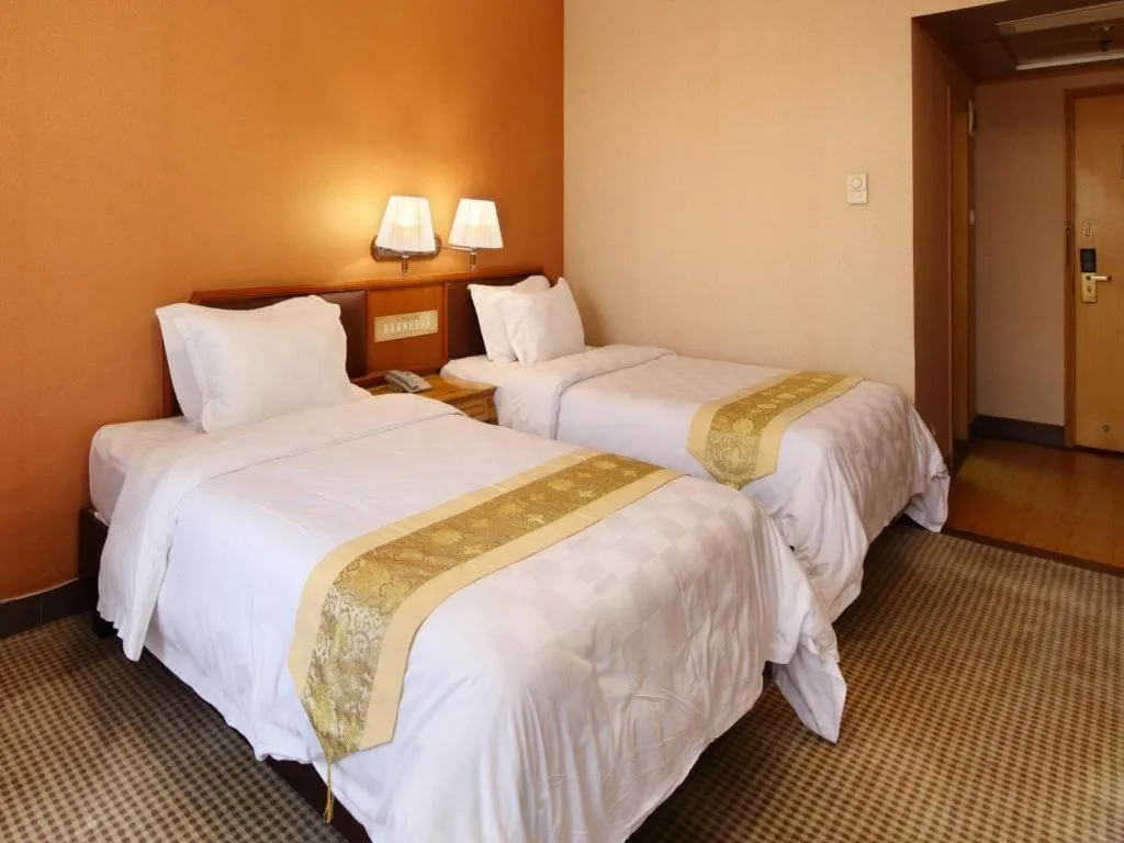 Bed in Nanfang Dasha Hotel