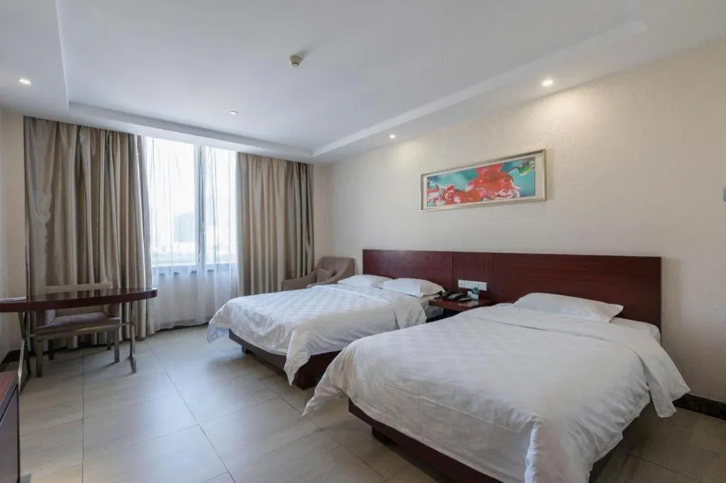 Bed in Nanfang Dasha Hotel