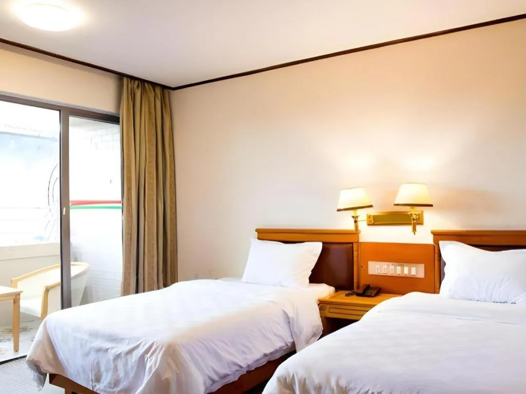 Bed in Nanfang Dasha Hotel