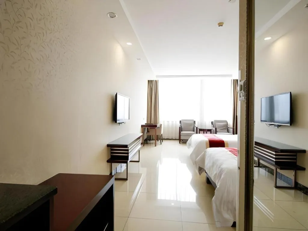 Bed in Nanfang Dasha Hotel