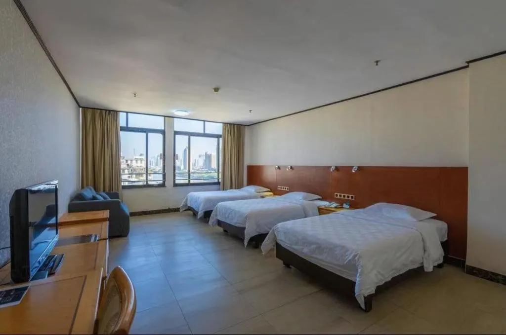 Bed in Nanfang Dasha Hotel