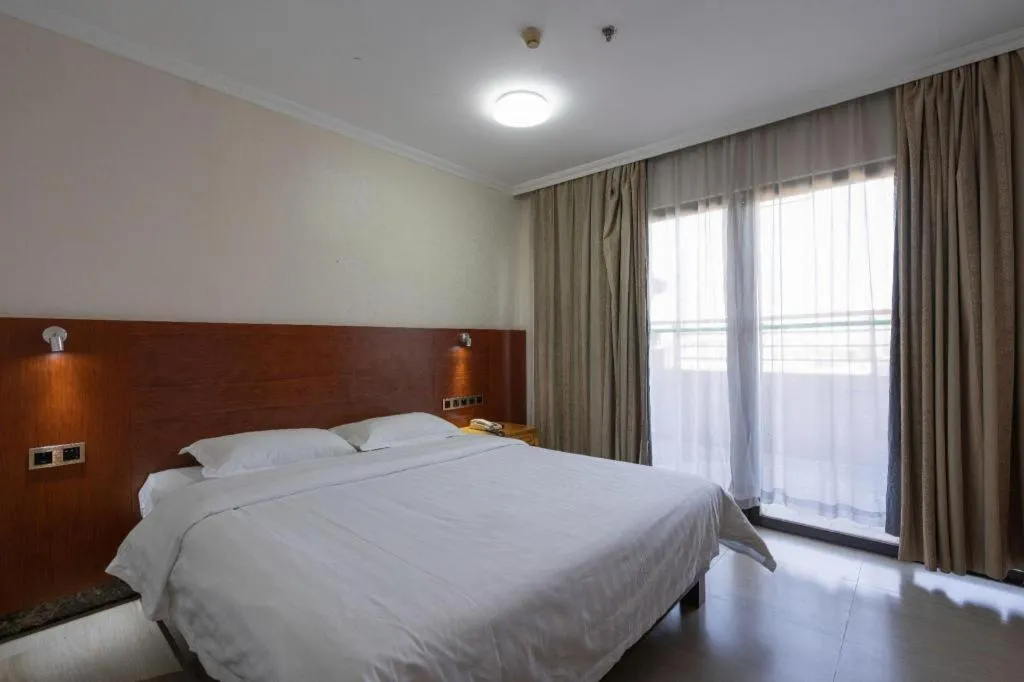 Bed in Nanfang Dasha Hotel