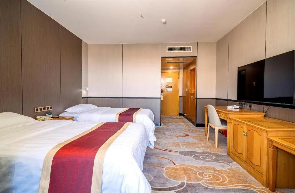 Bed in Nanfang Dasha Hotel