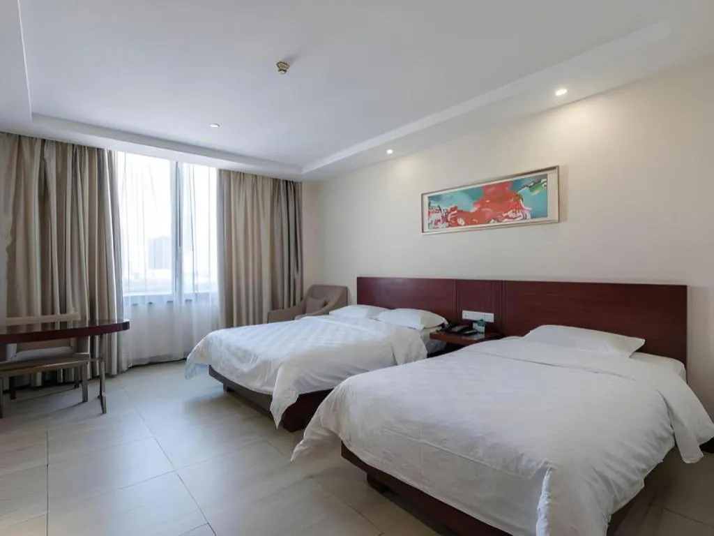 Bed in Nanfang Dasha Hotel