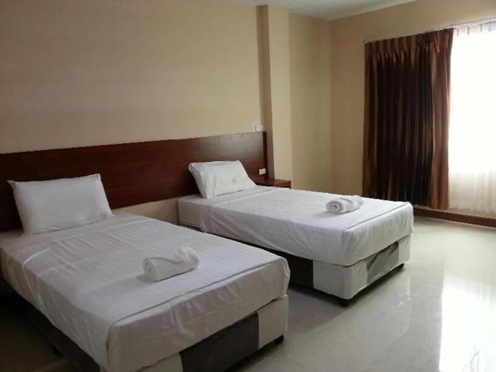 Bed in Le Parc Wangnang Hotel