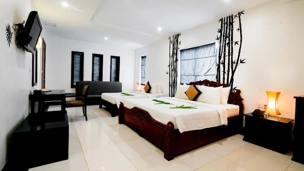 Bed in La Residence Blanc D' Angkor