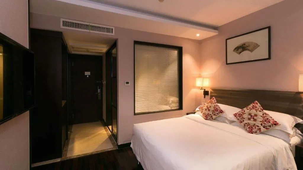 Bed in Yiwu Orange Boutique Hotel