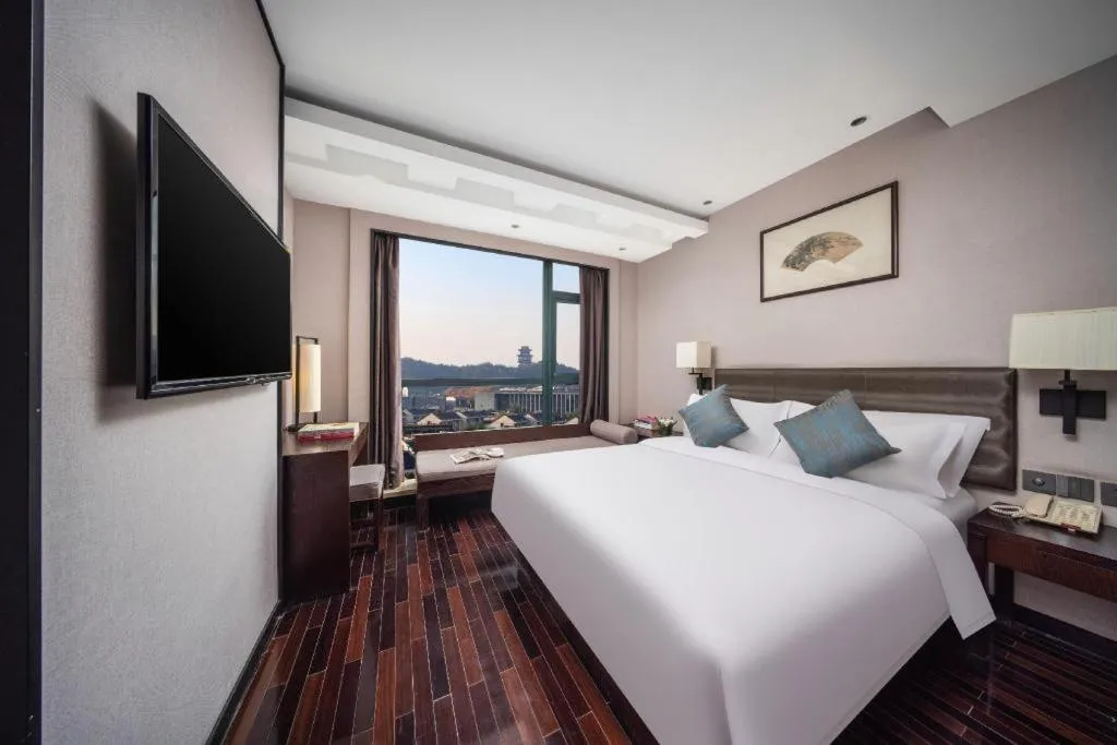 Bed in Yiwu Orange Boutique Hotel