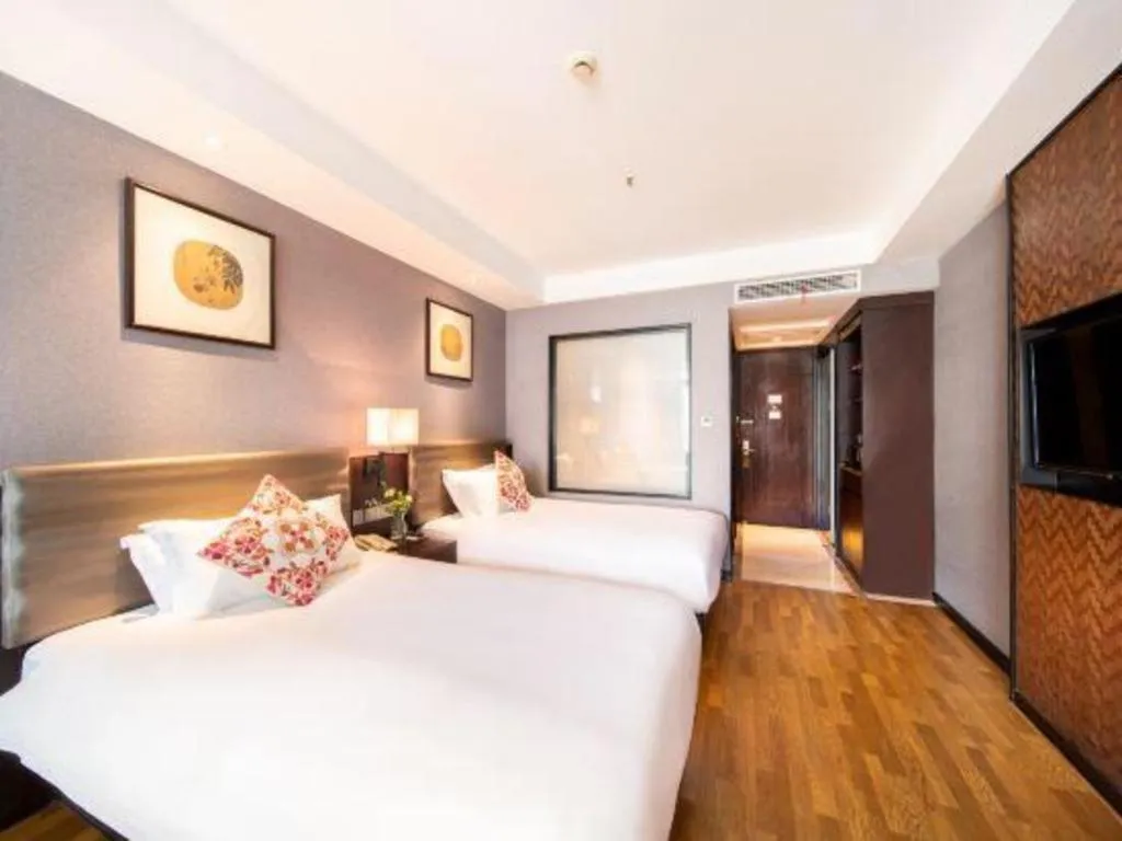 Bed in Yiwu Orange Boutique Hotel