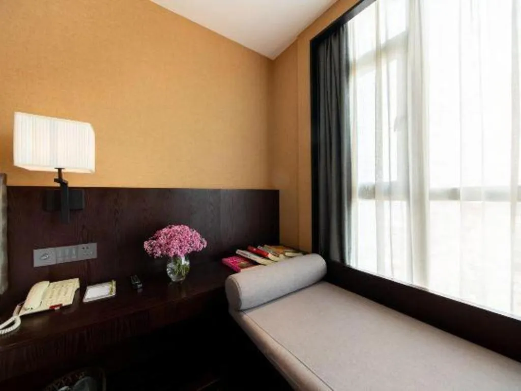 Bed in Yiwu Orange Boutique Hotel