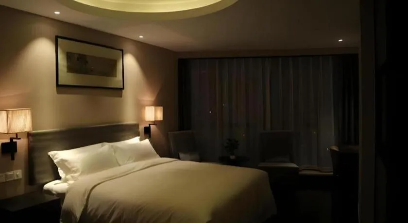 Bed in Yiwu Orange Boutique Hotel