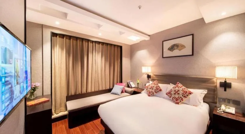 Bed in Yiwu Orange Boutique Hotel