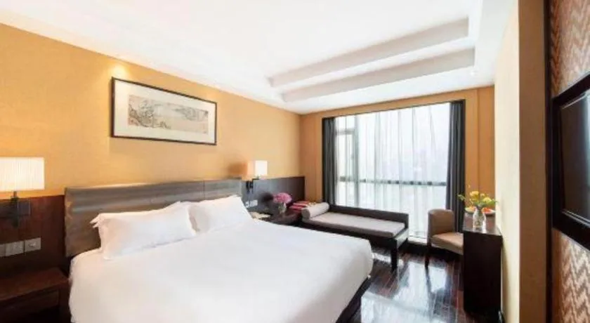 Bed in Yiwu Orange Boutique Hotel