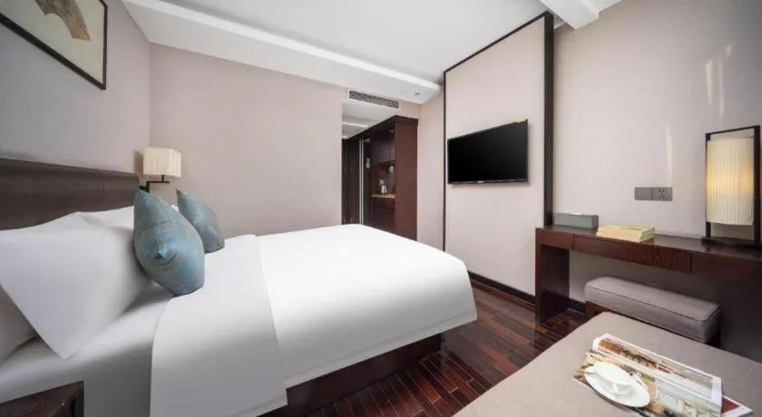 Bed in Yiwu Orange Boutique Hotel