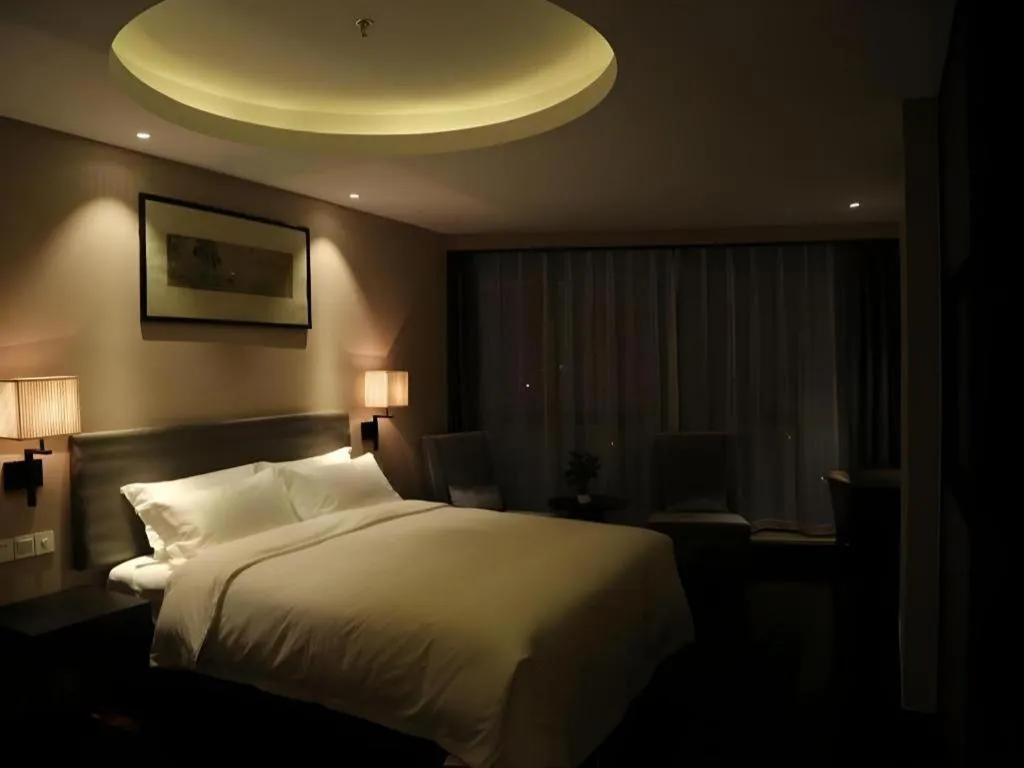 Bed in Yiwu Orange Boutique Hotel