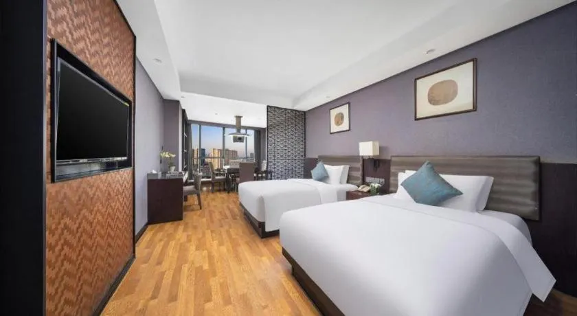 Bed in Yiwu Orange Boutique Hotel