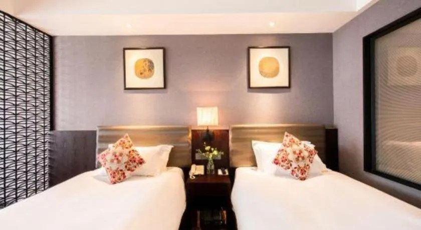 Bed in Yiwu Orange Boutique Hotel