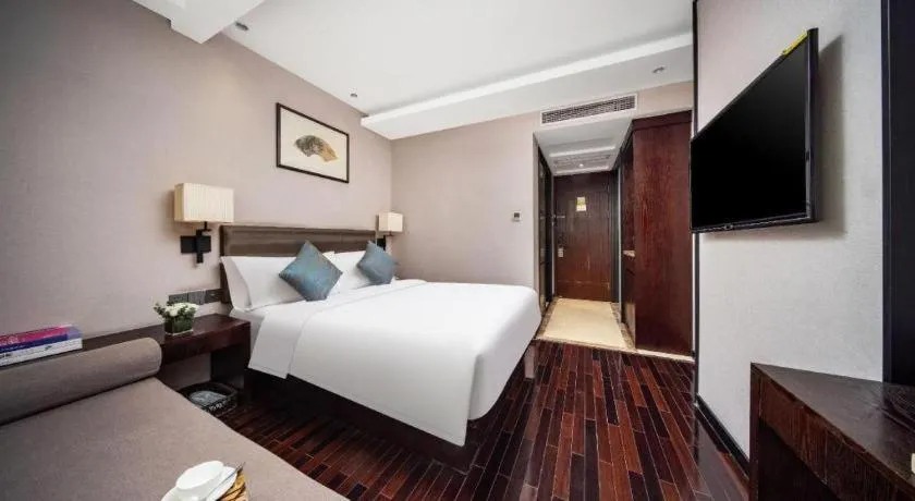Bed in Yiwu Orange Boutique Hotel