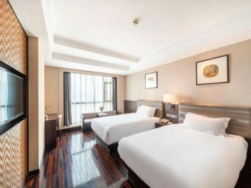 Bed in Yiwu Orange Boutique Hotel