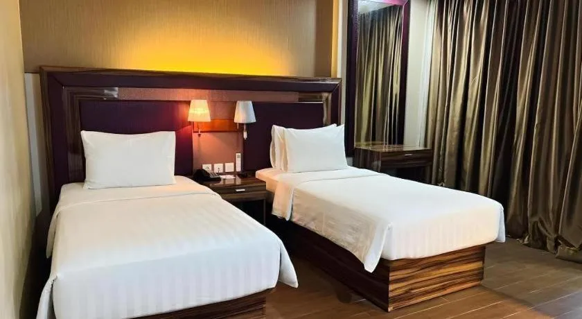 Bed in The Belagri Hotel and Convention