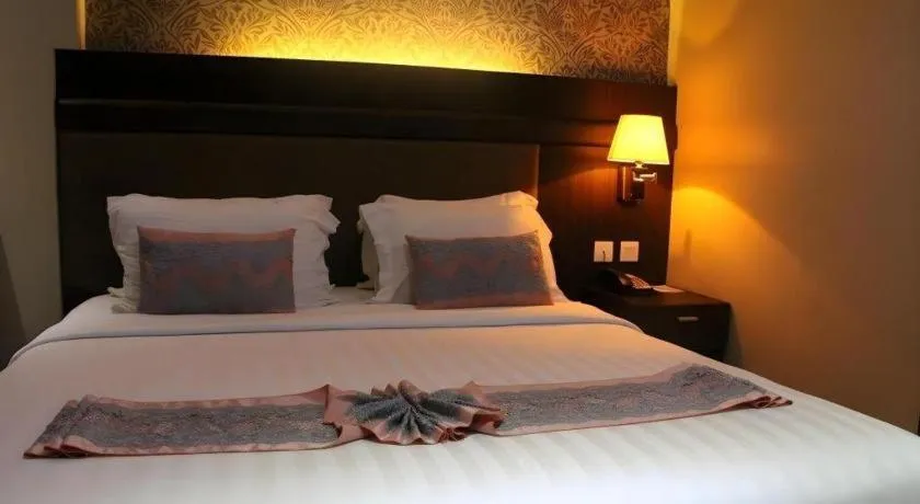 Bed in The Belagri Hotel and Convention