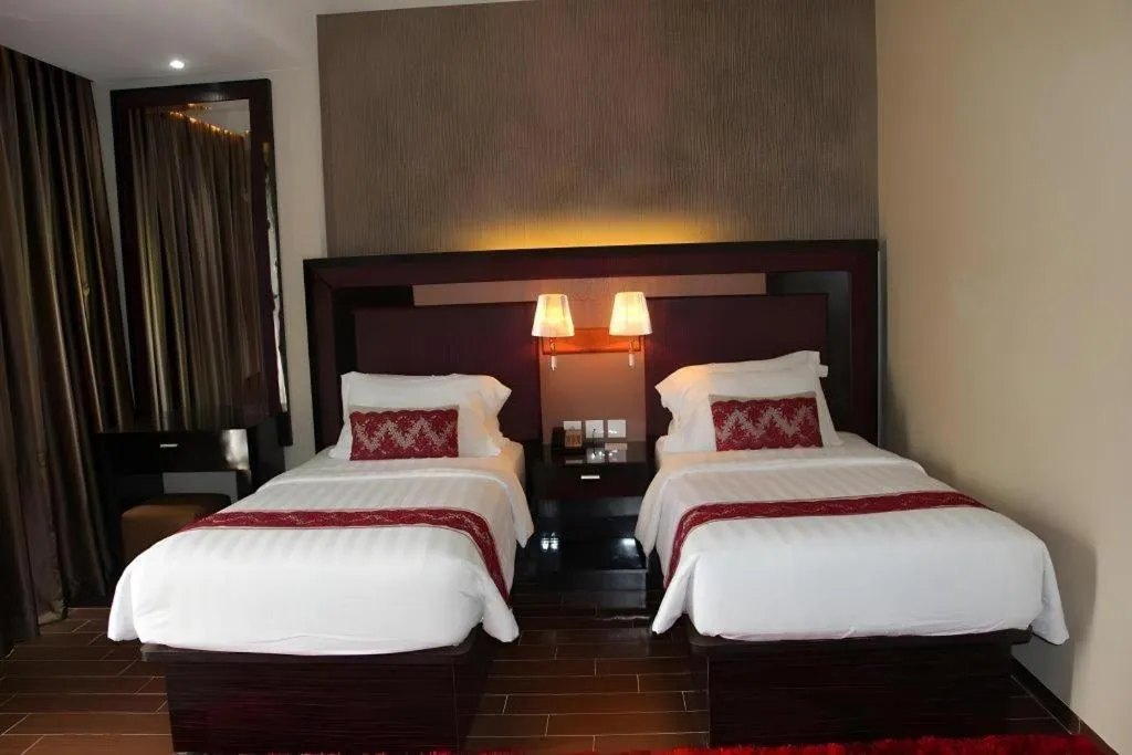 Bed in The Belagri Hotel and Convention