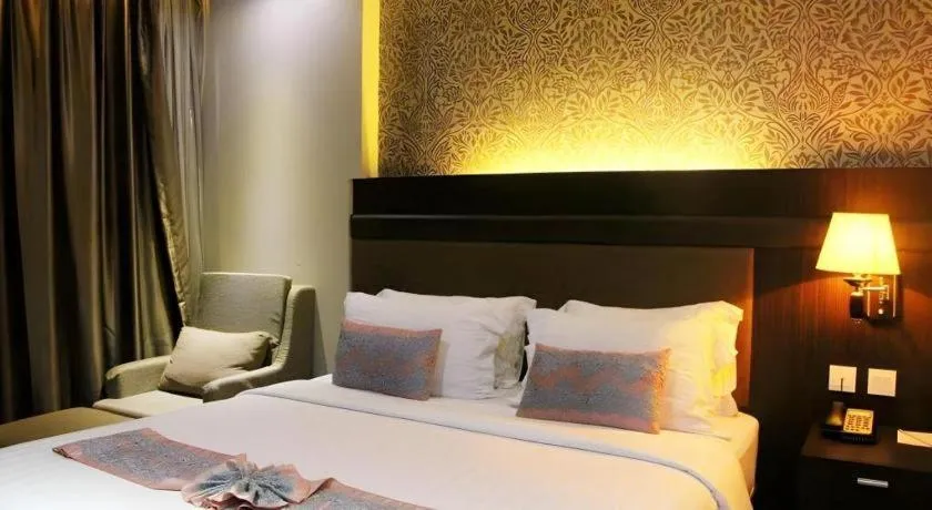 Bed in The Belagri Hotel and Convention