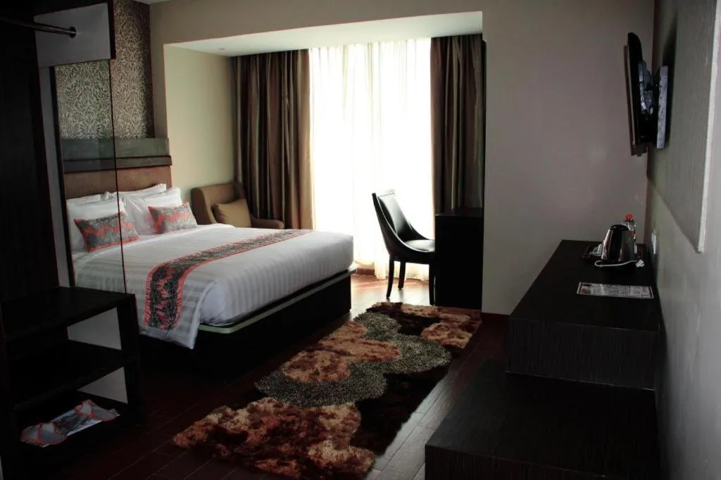 Bed in The Belagri Hotel and Convention