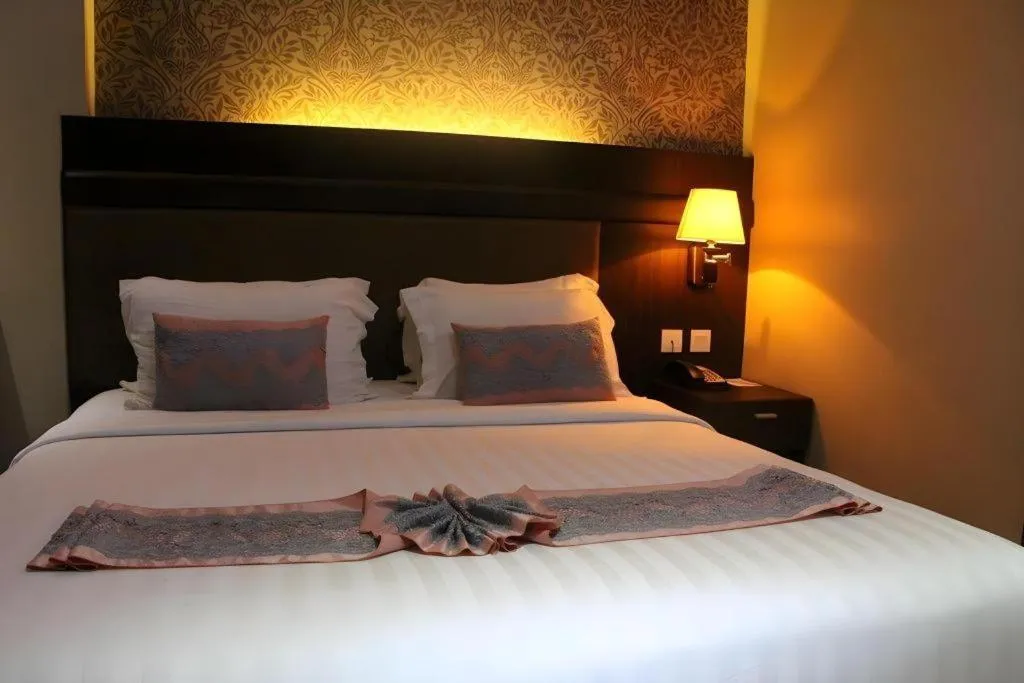 Bed in The Belagri Hotel and Convention