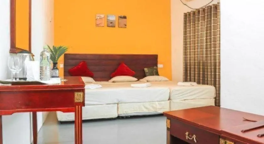 Bed in New Tristar Beach Hotel