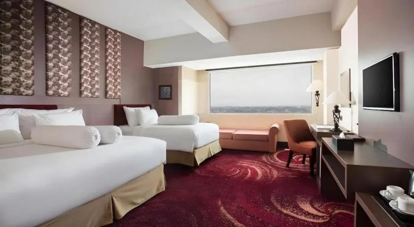 Bed in Indoluxe Hotel Jogjakarta