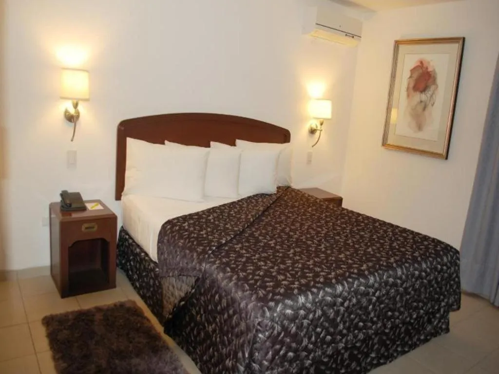 Bed in Terranova Suites