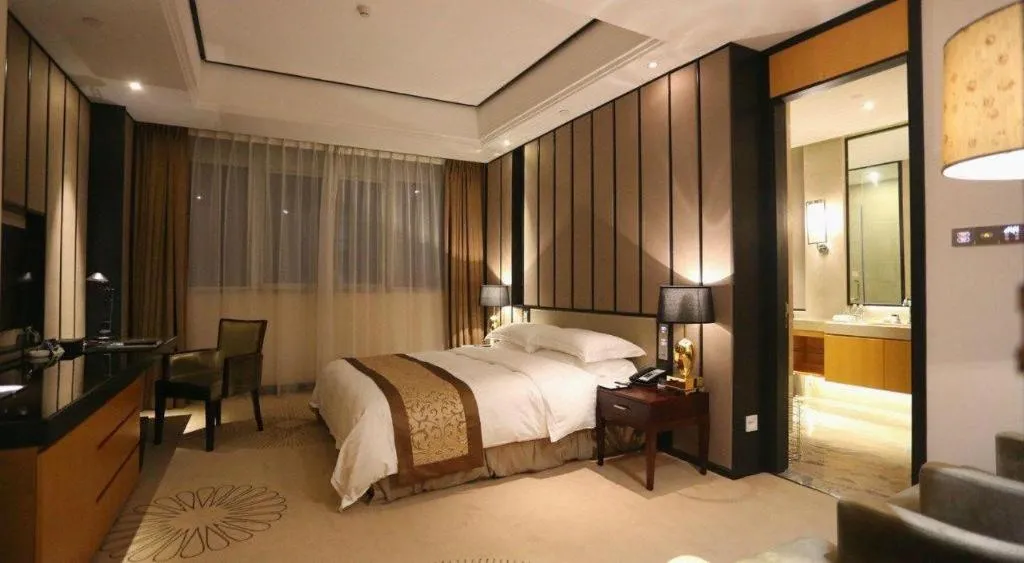 Bed in Jiuhua Jin Jiang International Hotel