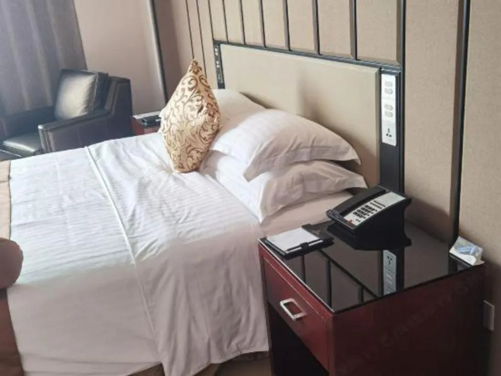 Bed in Jiuhua Jin Jiang International Hotel