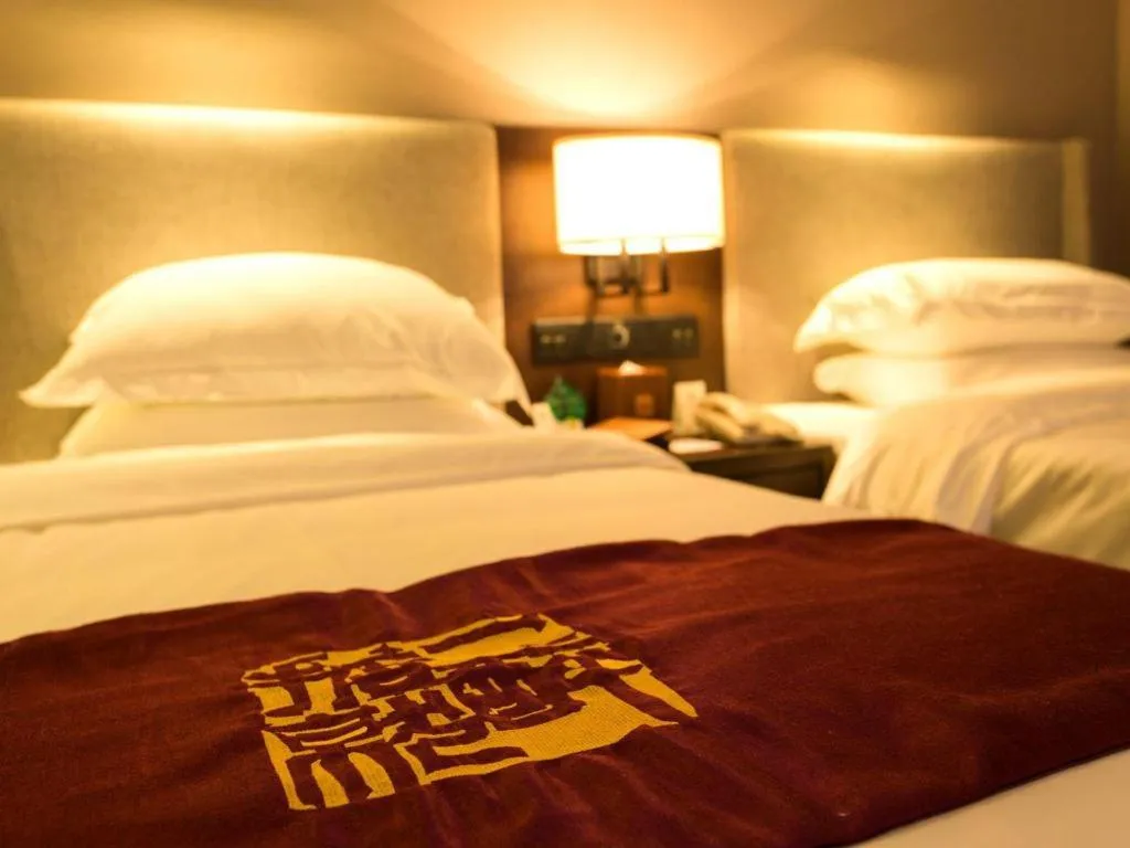 Bed in Zhuhai Starlight Hotel