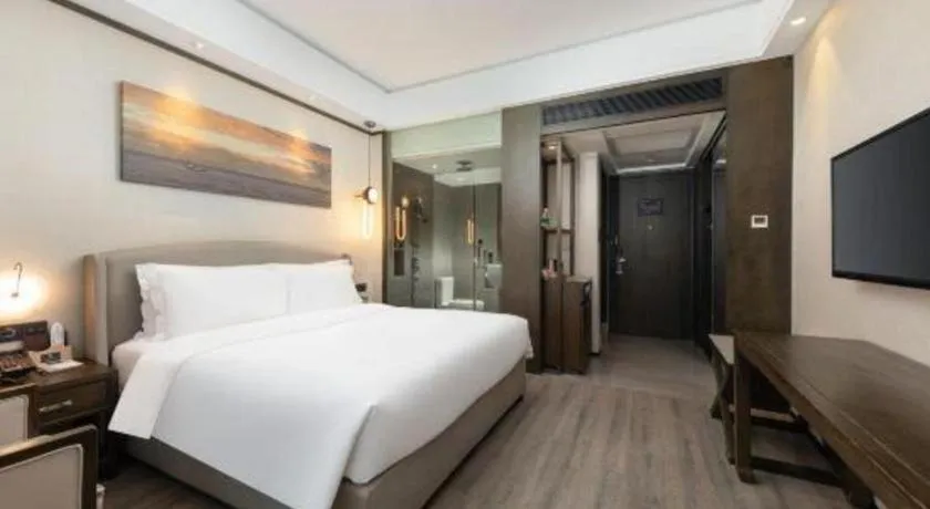 Bed in Zhuhai Starlight Hotel