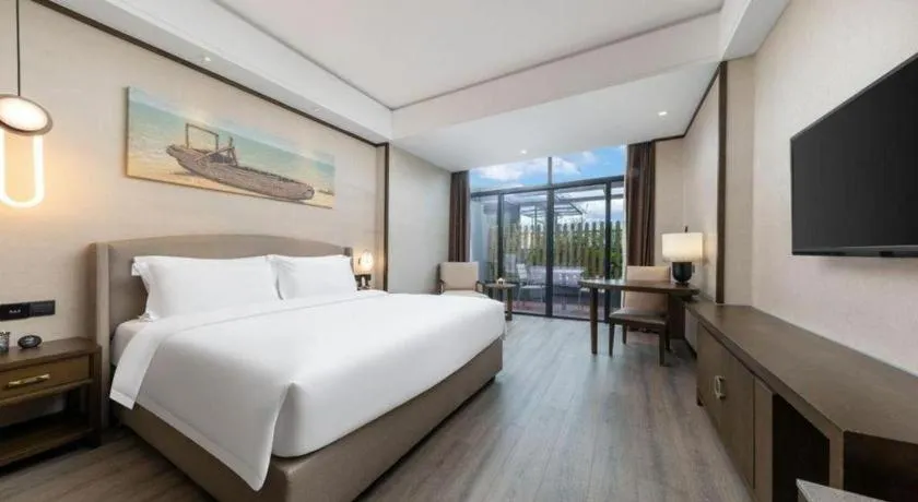 Bed in Zhuhai Starlight Hotel