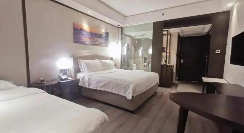 Bed in Zhuhai Starlight Hotel
