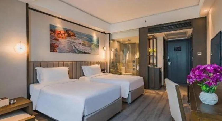 Bed in Zhuhai Starlight Hotel