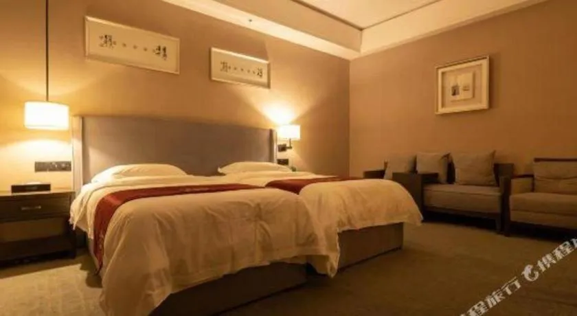 Bed in Zhuhai Starlight Hotel