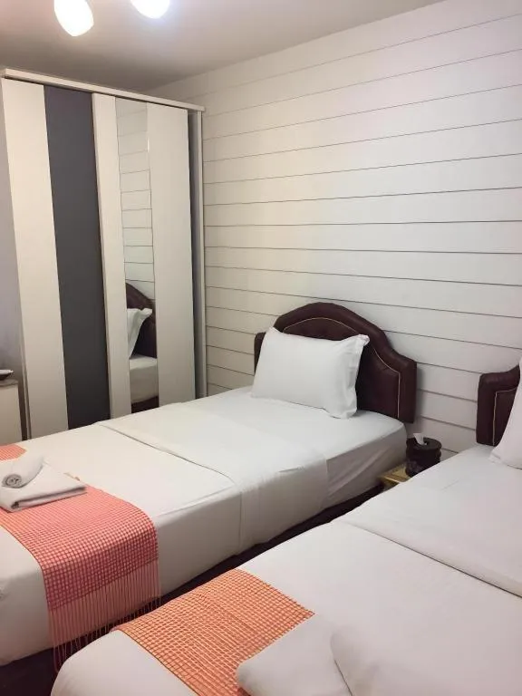 Bed in Ban Thungdang Housetel Bangkok