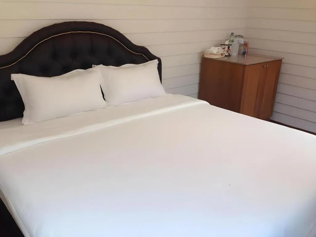 Bed in Ban Thungdang Housetel Bangkok