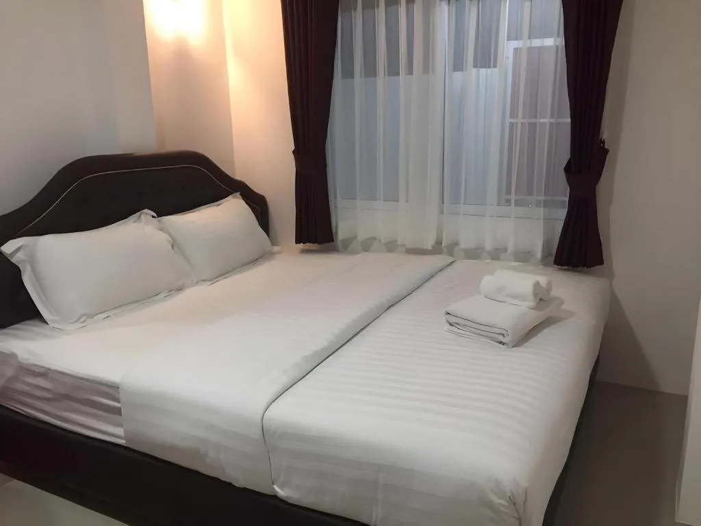 Bed in Ban Thungdang Housetel Bangkok