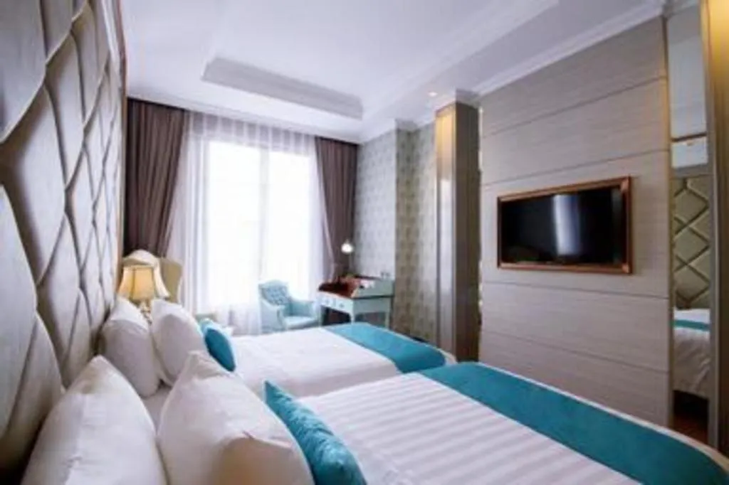 Bed in d'primahotel Bandung