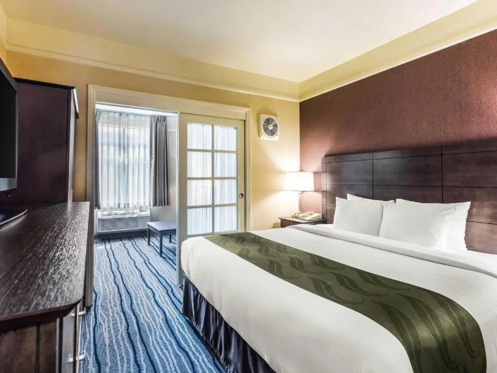 Bed in Ramada Suites by Wyndham San Diego